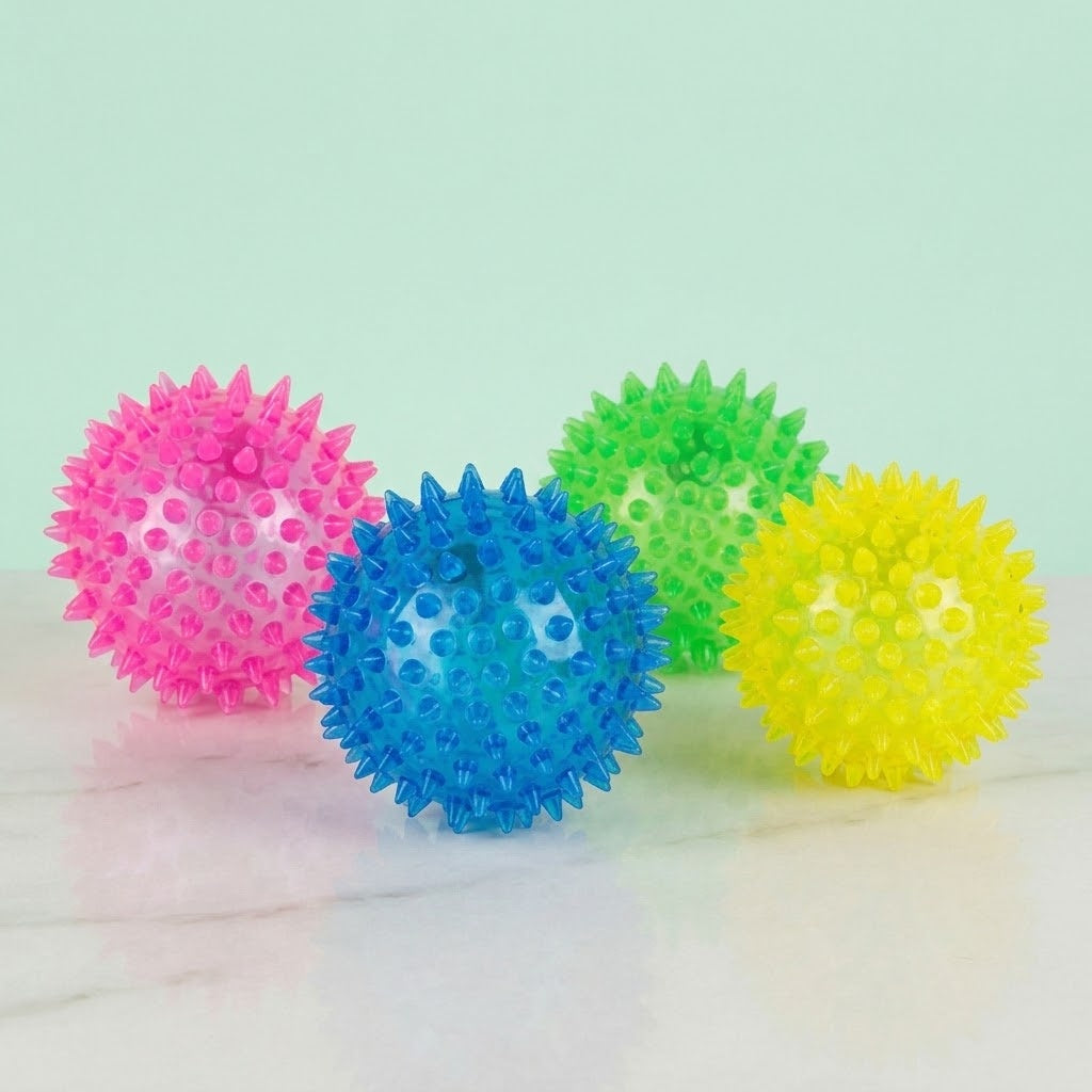 Light Up Spiky Bouncy Ball Sensory Ball 7.5 cm - studio photo